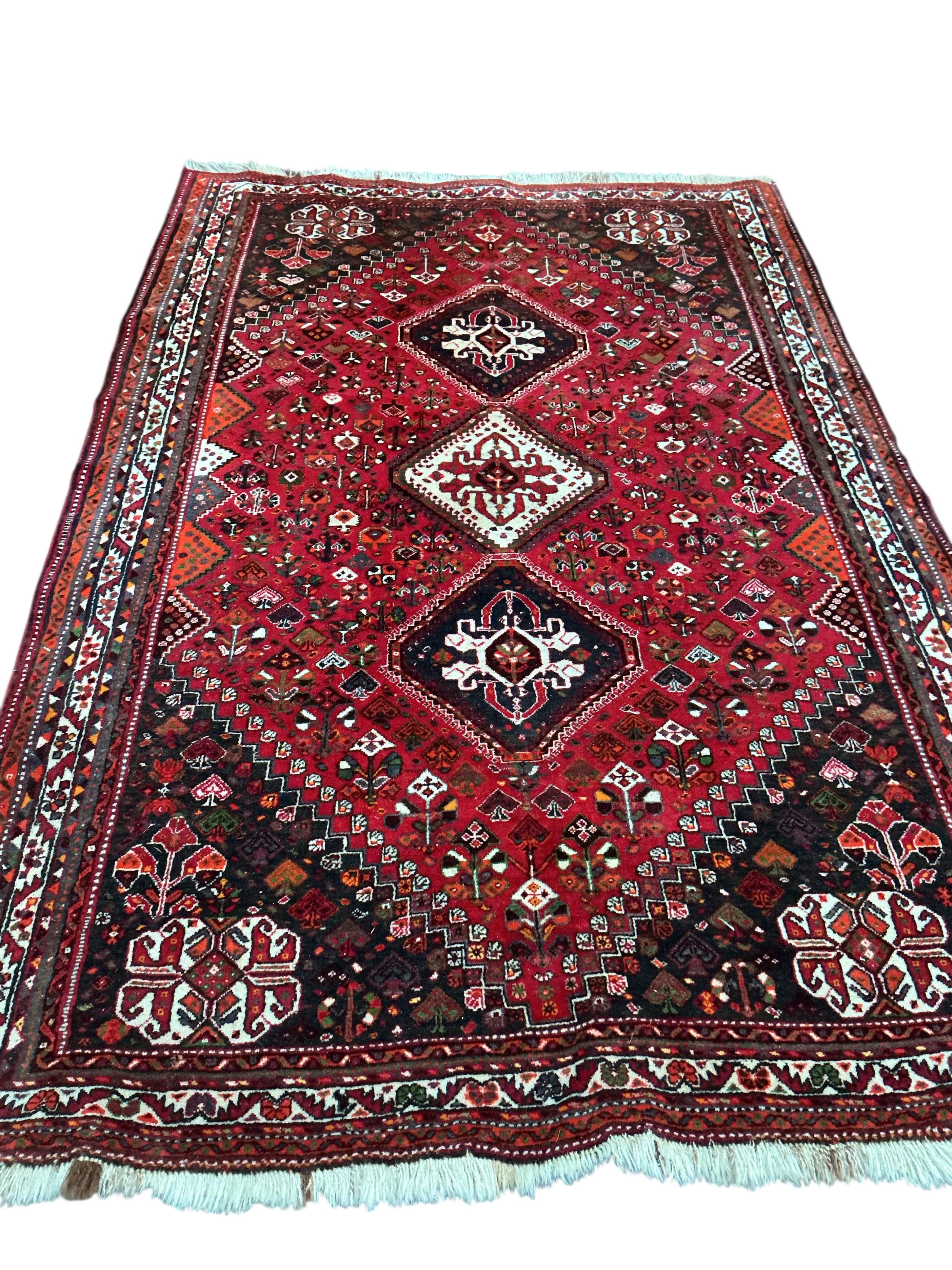 A Hamadan red ground carpet, 256 x 170cm